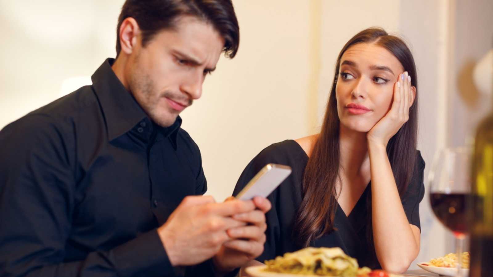 Etiquette on the Decline: Basic Manners Younger Generations Are No Longer Taught 62 Man using mobile during dating