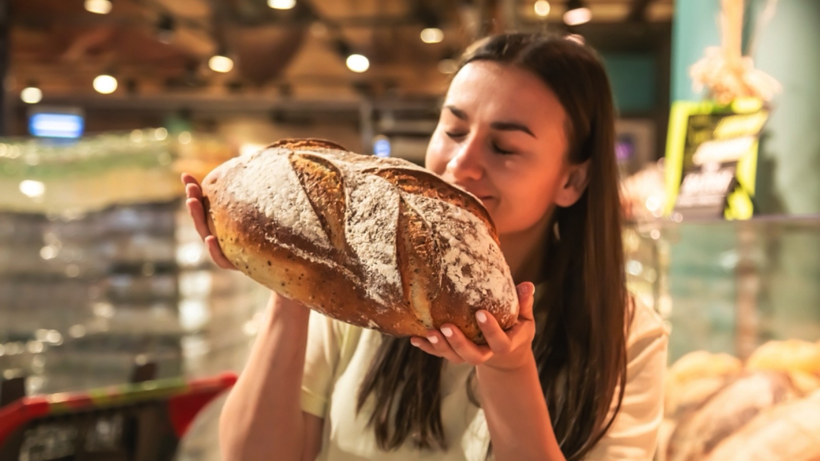 Crucial Money Mistakes Even Frugal People Make 169 Woman smelling fresh bread