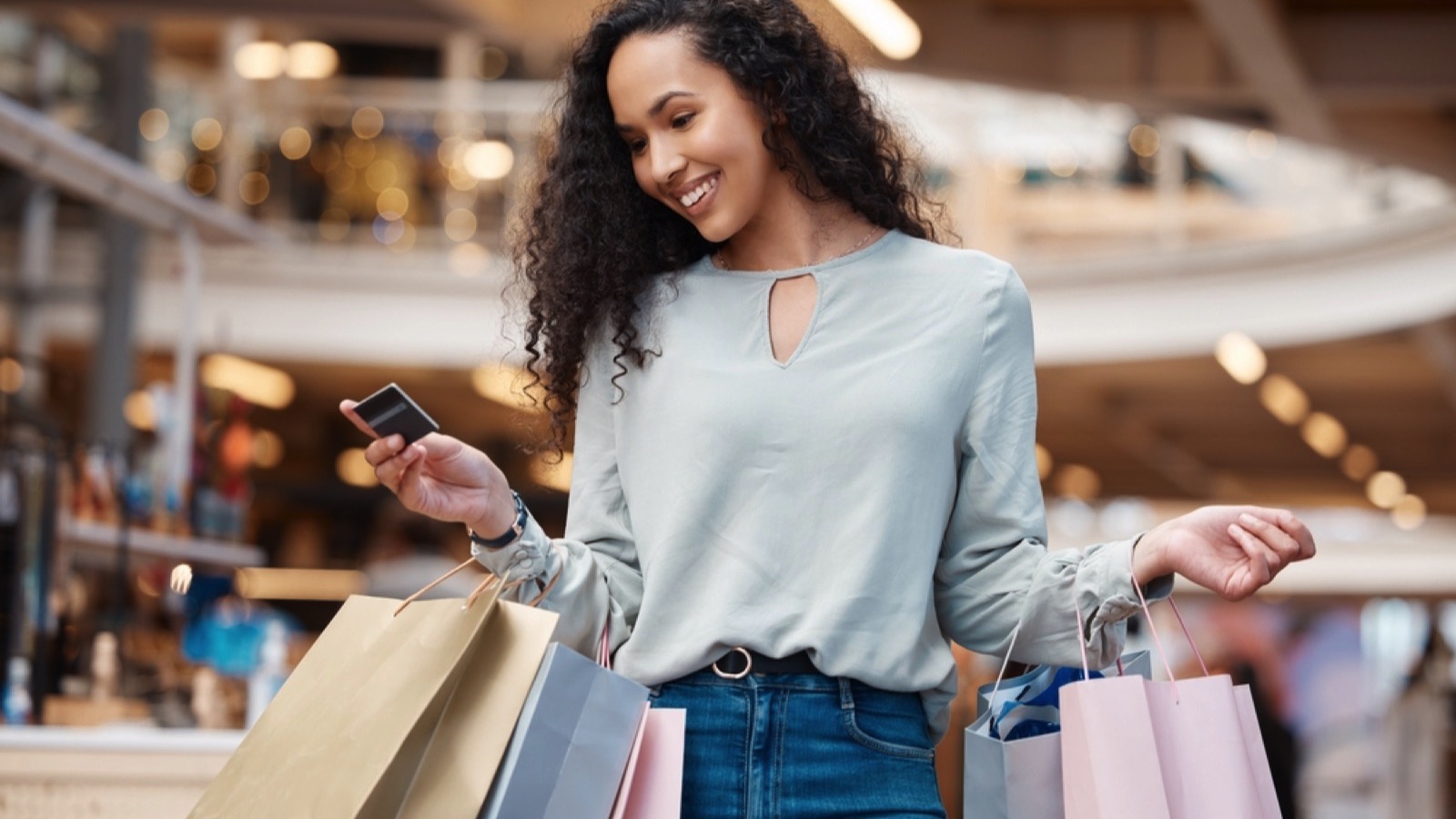 Crucial Money Mistakes Even Frugal People Make 181 Woman spending for shopping