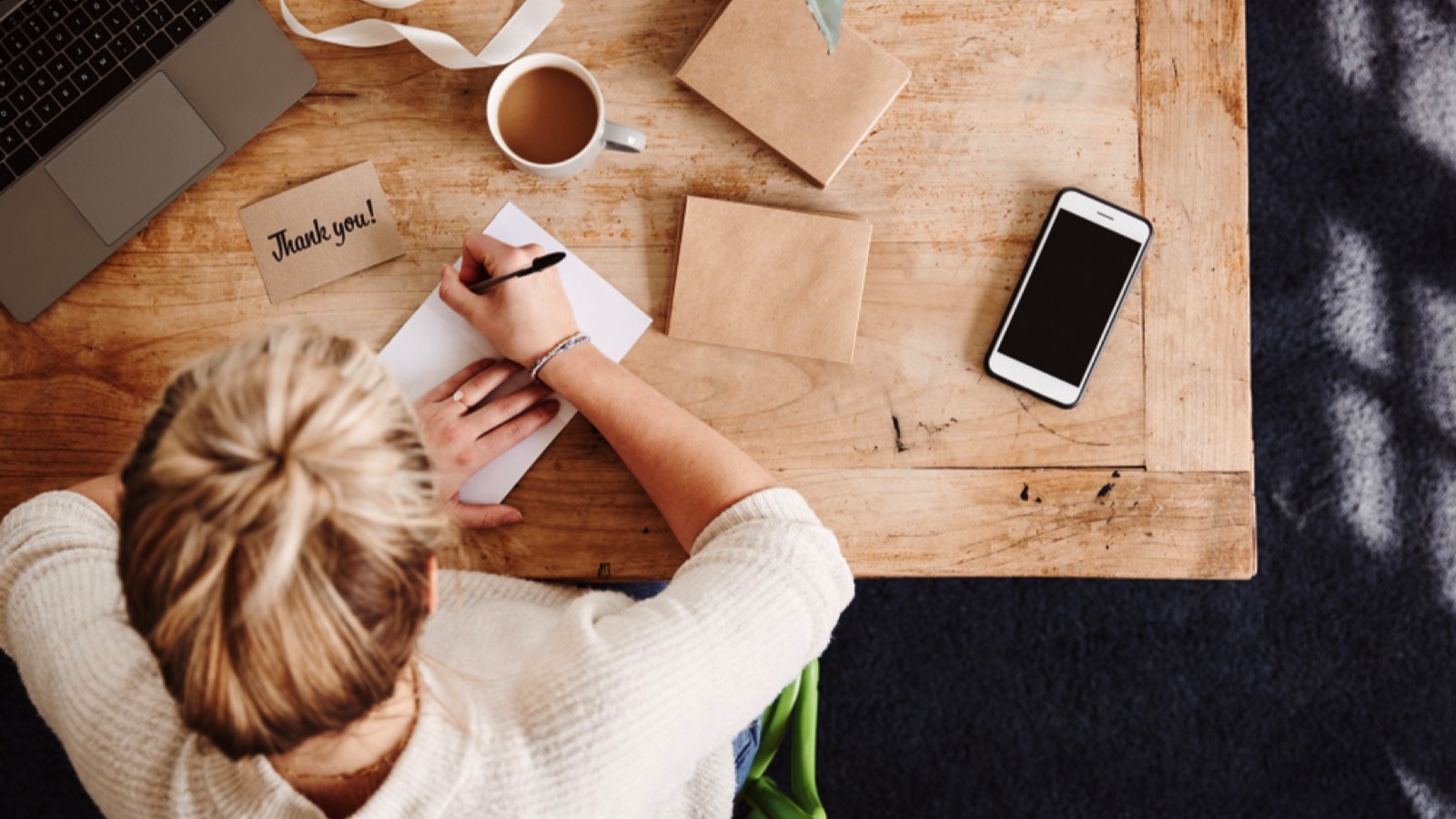 Etiquette on the Decline: Basic Manners Younger Generations Are No Longer Taught 69 Woman writing thank you note