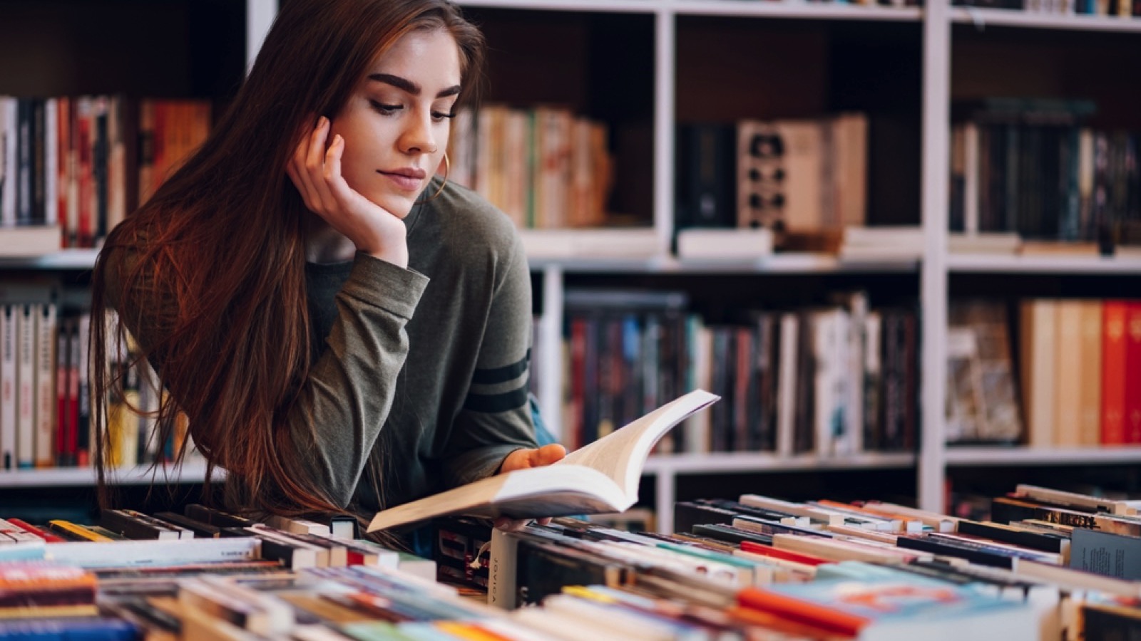 Crucial Money Mistakes Even Frugal People Make 182 woman in library reading book
