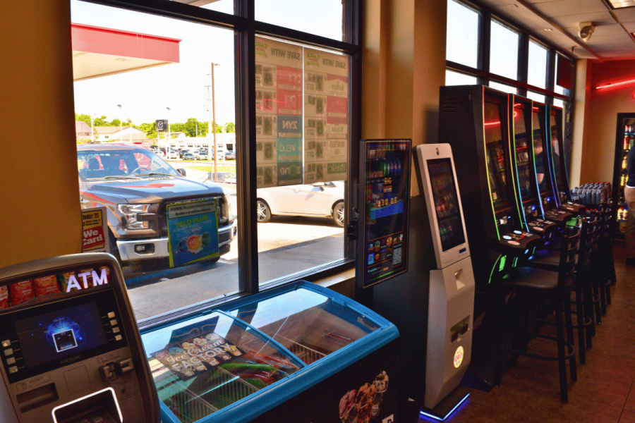 Illegal gambling machines and gaming kiosks line the interior of a Missouri convenience store during a statewide crackdown on unregulated gambling operations.
