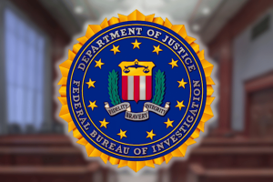 FBI seal displayed inside courtroom during federal fraud investigation involving Justice Department contractor phone theft gambling scheme