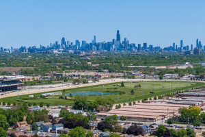 Aerial view of Hawthorne Race Course in Stickney, Illinois, with the Chicago skyline in the background as the historic horse racing venue undergoes Chapter 11 bankruptcy proceedings and a June 26 sale process.
