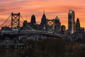 Philadelphia skyline at sunset featuring the Benjamin Franklin Bridge and Center City skyscrapers, Pennsylvania cityscape and urban landmark view. Pennsylvania gambling exclusions expand after child neglect