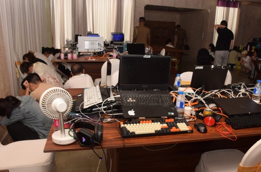 Police raid an alleged cybercrime scam center during an INTERPOL operation targeting illegal online gambling, investment fraud, romance scams and money laundering networks.