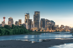 Calgary, Alberta skyline at dusk overlooking the Bow River as the province launches its regulated online gambling market with 22 licensed operators.
