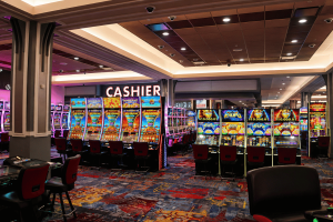 Resorts World New York City casino floor with rows of slot machines following expansion to 3,900 gaming machines in Queens