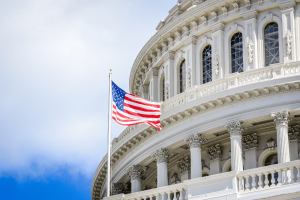 U.S. Capitol building with American flag as Senate Democrats debate prediction market regulation and tribal gaming protections