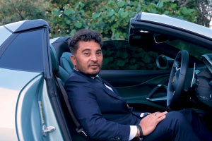 Laurence Escalante, founder of Virtual Gaming Worlds (VGW), seated in a convertible sports car.