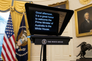 White House teleprompter displays speech text amid controversy over alleged Trump-linked prediction market betting.