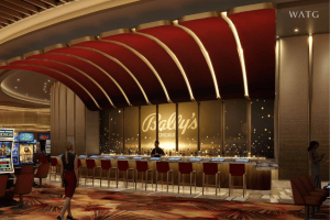 Rendering of Bally's Chicago casino bar and gaming floor featuring a central cocktail bar, slot machines and modern interior design inside the $1.7 billion Chicago riverfront resort.