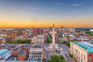 Baltimore skyline at sunset overlooking the Washington Monument and historic downtown Baltimore, Maryland. Baltimore sues Kalshi and Polymarket over allegedly illegal sports betting markets