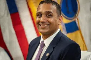 Prospect Park Councilman Anand Shah pictured in a suit at a municipal government event in New Jersey. Anand Shah resigns after admitting to illegal gambling role
