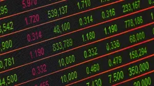 A close-up view of a financial trading screen with green and red numerical data on a black background.