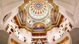 Interior view looking up at the ornate dome and murals of the Pennsylvania State Capitol